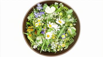 Fresh wildflower salad in bowl for vibrant summer dining and natural decoration photo