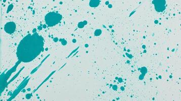 Abstract cyan paint splatter texture with grunge overlay for creative design projects photo