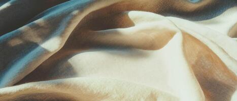 Subtle linen texture showcasing warm neutral tones in a soft fabric drape photo
