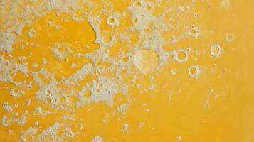 Abstract saffron textured surface with moon-like patterns for creative design photo