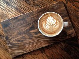 Aromatic Delight A Cappuccino with Exquisite Latte Art on a Rustic Wooden Platter photo