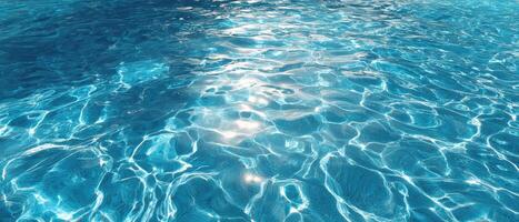 A blue pool with water and sunlight photo