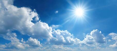 The sun shines brightly in the blue sky photo