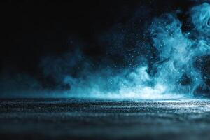 Blue smoke and light on a black background photo