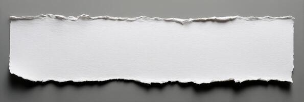 A piece of white paper on a gray background photo