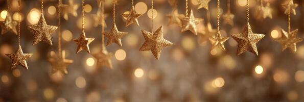 Golden christmas stars hanging from strings photo