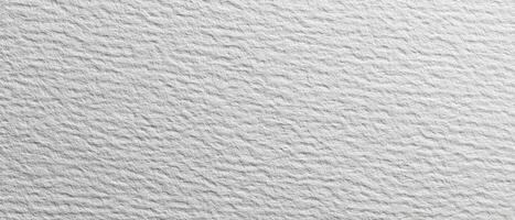 A white wall with a few small white spots photo