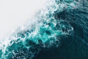 An aerial view of the ocean with waves photo