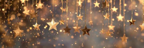 Golden stars hanging from strings in the air photo