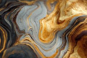 A close up of a gold and black marble surface photo