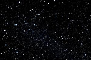 A large group of stars in the night sky photo