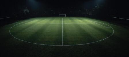A soccer field at night with lights shining on it photo
