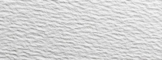 Detailed Examination of Rough White Wall Surface Revealing Fine Textures and Subtle Variations in Light and Shadow Creating Visual Texture Richness Enhancing Depth photo