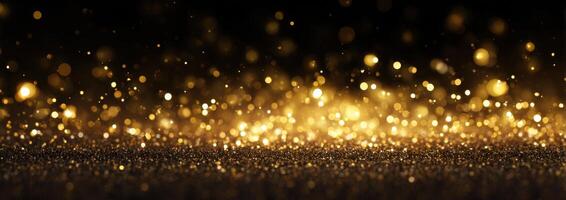 Golden glittering light on black background photo