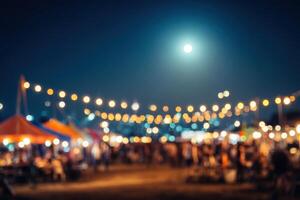 Blurred night market with people and lights photo