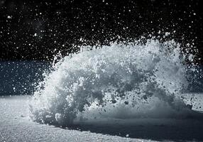 A snow ball is being thrown into the air photo