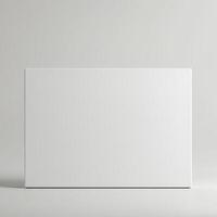 Blank white box on a plain surface photo
