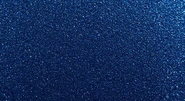 A blue background with a lot of small glitter photo