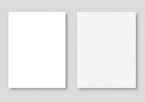 Two blank white paper templates on a gray background photo