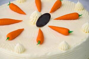 Decorated Carrot Cake, featuring moist and spiced cake layers covered in smooth cream cheese frosting closeup top view of delicious cake photo