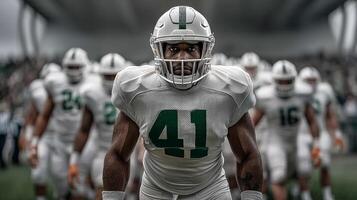 Football team captain in white uniform and helmet standing in center of field photo