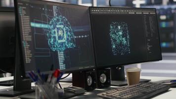 Close up of artificial intelligence AI development workstation in data center with dual monitors. Server room PCs used for tracking neural network algorithms performance, handheld camera shot video