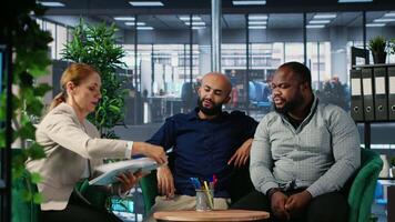 Corporate professionals discussing global market trends in boardroom, sharing expertise and performance metrics. Building a success story through planning and strong leadership skills. Camera B. video