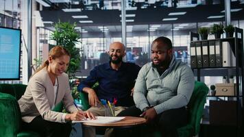 Business people signing a legal certified form to ensure their partnership, agreeing to terms and conditions after the meeting. CEOs collaborating with a new deal, success story. Camera A. video