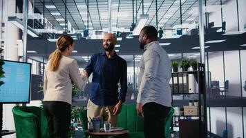 Multicultural group of CEOs welcoming each other in a negotiations meeting, discussing latest details for a new successful partnership between their international corporations. Networking. Camera A. video