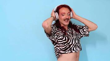 Non-binary person dancing and listening to music with headphones video