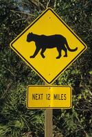 A sign that says next 12 miles photo
