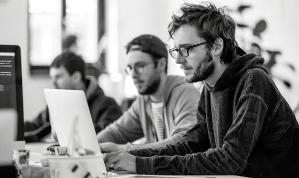 Focused development team working diligently in a bright office photo