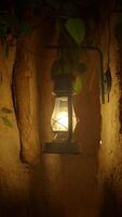 Warm glow of lantern in a rustic setting at night video