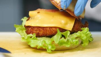 Crispy chicken sandwich preparation at local diner video