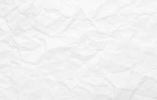 Wrinkled white paper texture with light folds and shadows, perfect for grunge or creative design use. photo