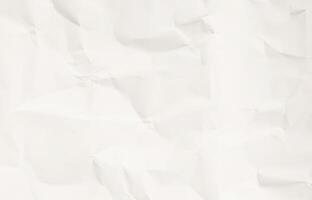 Crumpled white paper texture with soft shadow folds photo