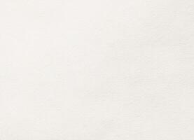 Soft white paper texture with subtle grain, ideal for backgrounds, stationery, or digital design overlays. photo