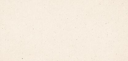 Organic beige recycled paper texture with subtle fiber details and natural specks, seamless background photo