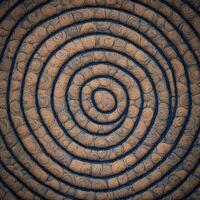 A spiral pattern made of brown and blue fabric photo