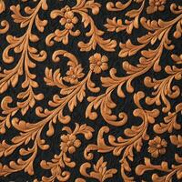 A black and gold floral pattern on a black background photo