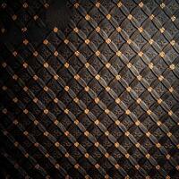 A black and gold patterned wall with a diamond pattern photo