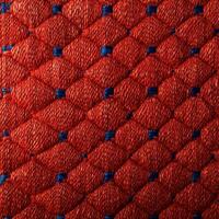 A close up of a red and blue woven fabric photo