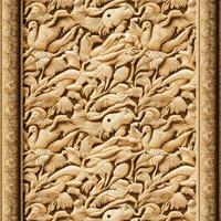 An ornate wood carving with birds and flowers photo