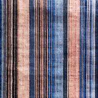 A close up of a striped fabric with blue, pink and white stripes photo