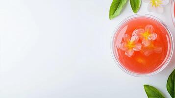 Two bowls of fruit and flowers on a white surface photo