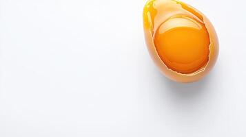 An egg is broken in half on a white surface photo