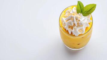 A smoothie with whipped cream and a green leaf photo