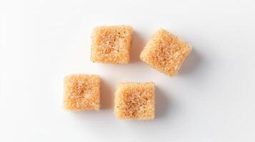 Four pieces of sugar cubes on a white surface photo