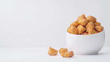 A white cup filled with fried chicken photo