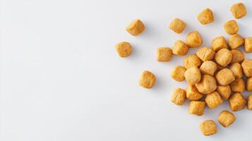A pile of peanuts on a white surface photo